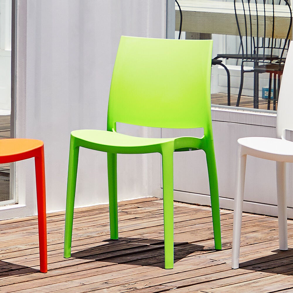 Stackable outdoor dining chair in lime green with molded seat and back