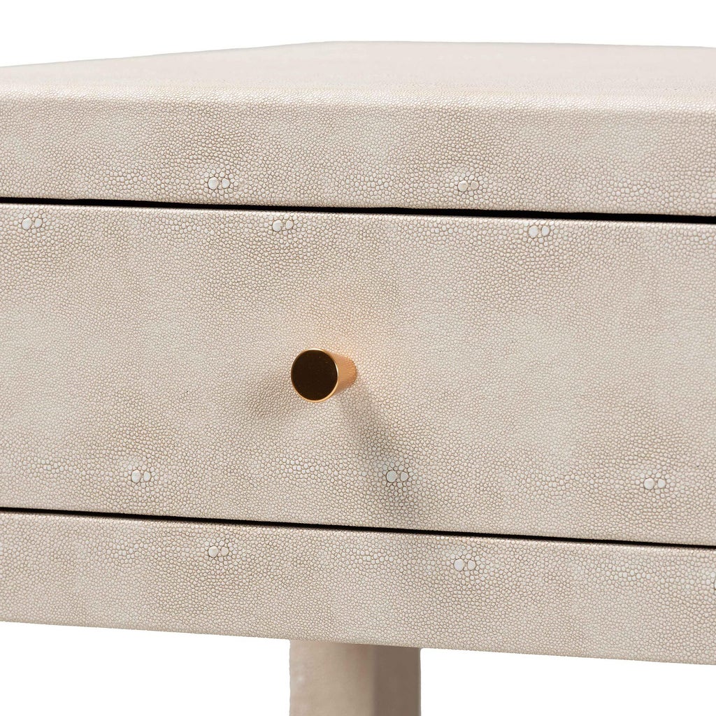 Close-up of beige faux shagreen texture and drawer knob