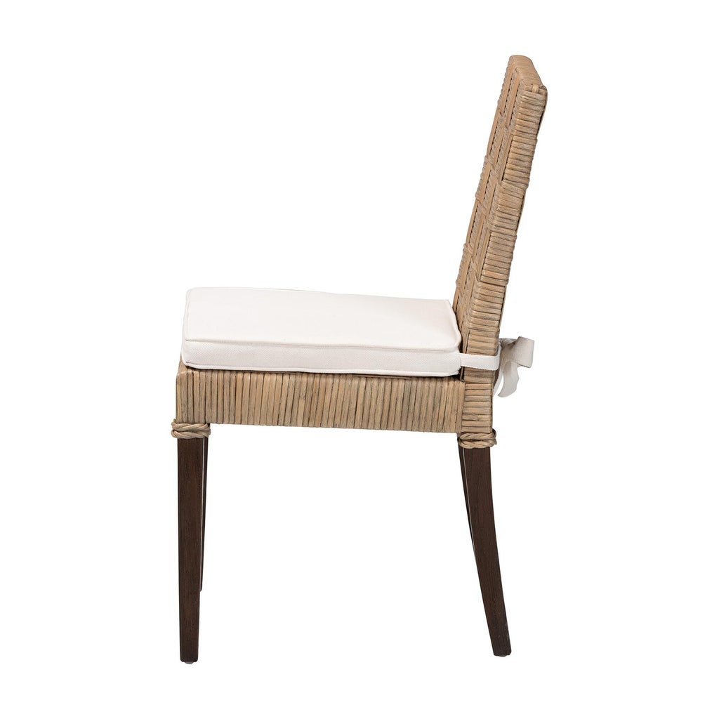 Natural rattan dining chair angled view with off-white cushion