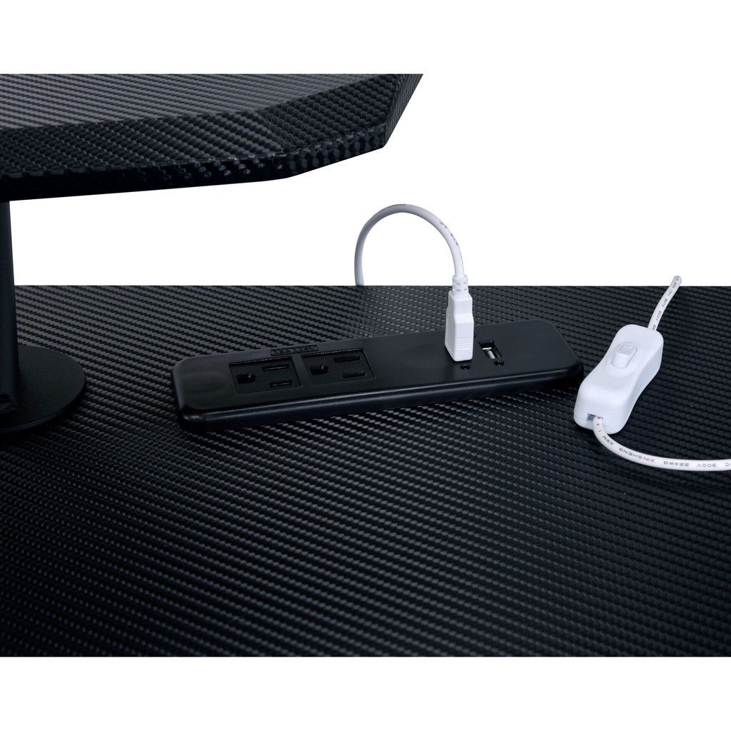 Power strip with USB outlets on desk surface