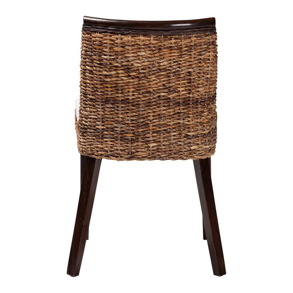 Close-up of woven seagrass dining chair back with dark brown wood top rail