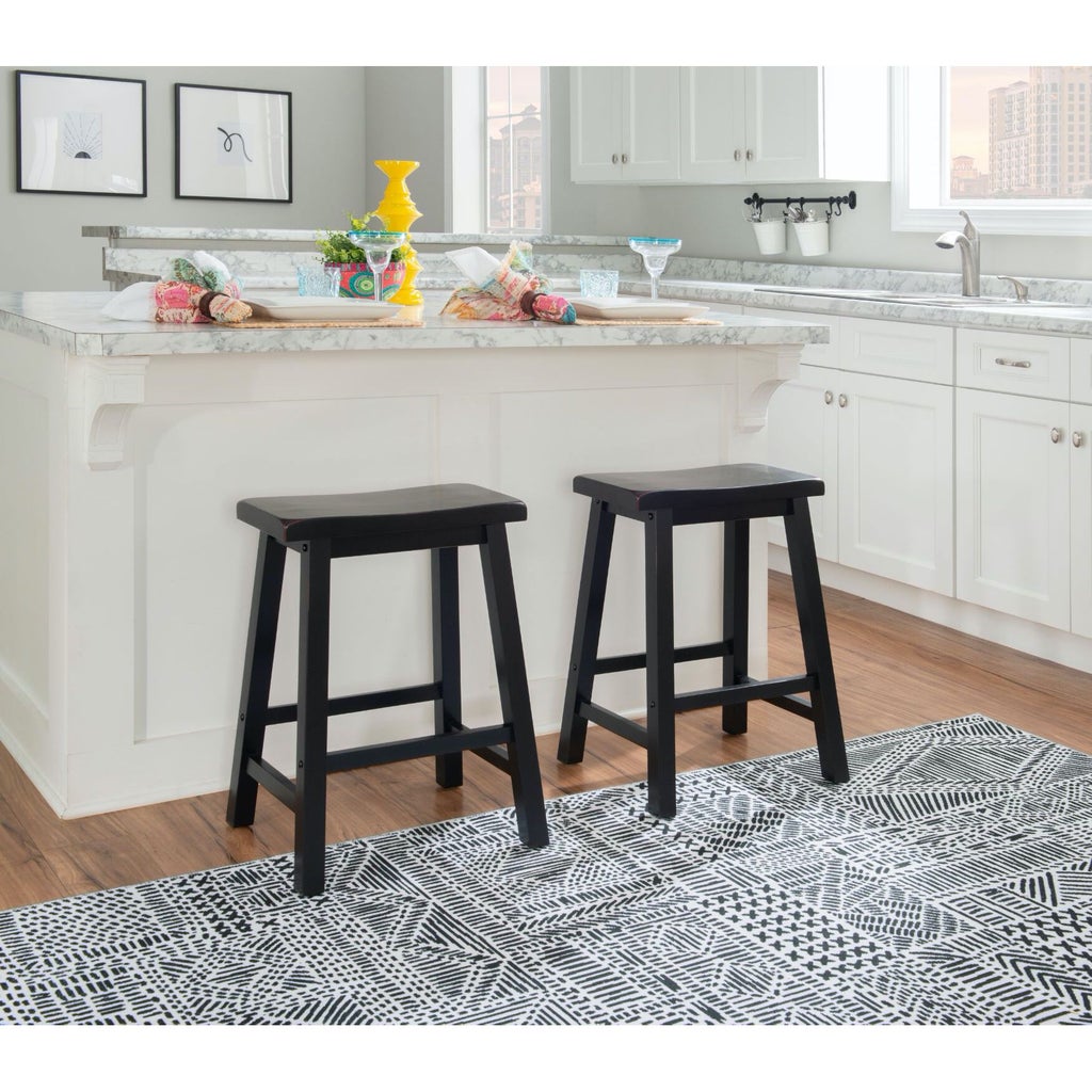 Two black stools with white kitchen island