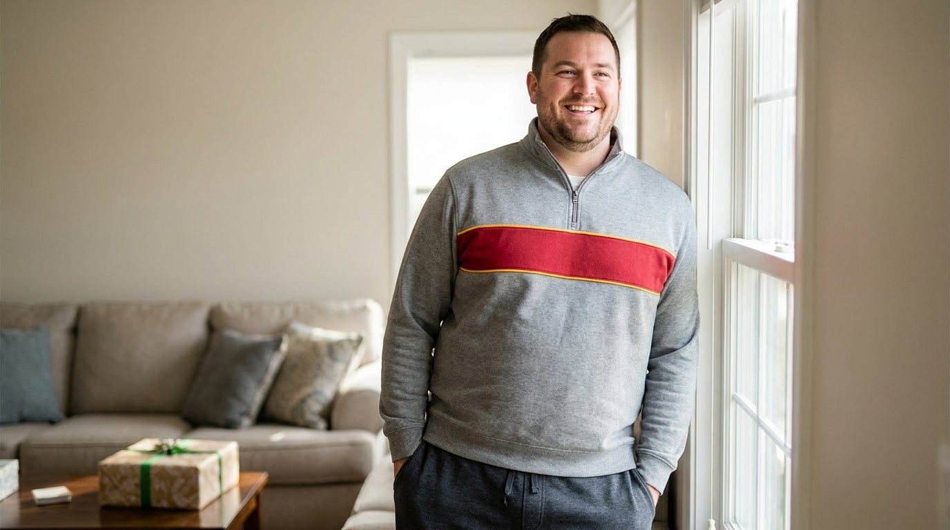 Big and Tall man wearing a fan-style graphic tee at home in a gifting-occasion setting